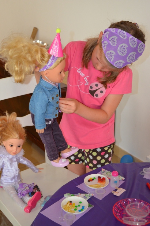 Riley getting her doll ready for the party.